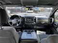 Interior view of a 2017 GMC Sierra 1500 showing dashboard steering wheel center console and infotainment system