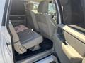 Interior of a 2013 Ford Expedition showing leather seating in the second row with a view of the front dashboard and controls