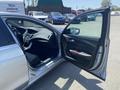 A 2017 Acura TLX with the driver's side door open showcasing the interior features including the dashboard and seats