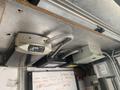 Two electrical control boxes mounted on a ceiling, including a larger rectangular box and a smaller square box, with cables connected to them
