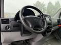 Interior view of a 2016 Mercedes-Benz Sprinter showing the steering wheel and dashboard with controls and display components