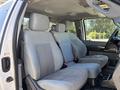 Interior of a 2016 Ford F-550 featuring gray fabric upholstery with two front seats and a center console visible