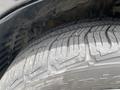 Close-up of a tire from a 2015 Kia Sorento showing tread pattern and wear
