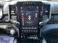 Interior dashboard of a 2019 RAM 1500 showing a touchscreen display with various controls and options for audio and settings