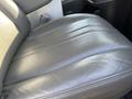 A close-up of a black leather seat in a 2014 Chevrolet Express showing its smooth texture and stitching