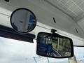 Interior mirrors of a 2018 Grande West Vicinity bus showing blue patterned seats in the reflection