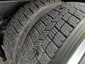 Close-up of a rugged tire with deep treads on a 2008 International 7500 showcasing wear and texture of the rubber surface