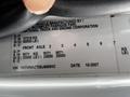 A close-up of a manufacturer's plate from a 2008 International 7500 truck displaying weight specifications and a vehicle identification number