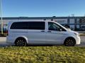 A 2022 Mercedes-Benz Metris van in white with black accents and large alloy wheels viewed from the side