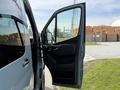 A 2019 Mercedes-Benz Sprinter van with the driver's side door open showcasing the interior door panel and side mirror