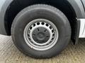 Close-up of a wheel on a 2021 Mercedes-Benz Sprinter with a silver rim and a black tire featuring a tread pattern