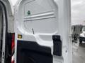 The image shows the interior rear door of a 2018 Ford Transit with a lock setup and wiring visible