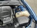 Close-up of a 2022 Dodge Charger engine, featuring the 36L VVT engine block, coolant reservoir, and air intake components