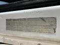 A 2016 Ford F-550 truck with a vehicle identification label detailing specifications and manufacturing information