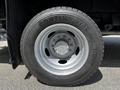 A close-up of a 2016 Ford F-550 tire featuring a Continental HDR tread pattern with a silver wheel rim and six bolt holes