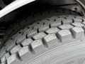 Close-up of a tire on a 2006 Sterling L7500 featuring a deep tread pattern designed for durability and traction