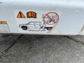 A 2015 Ford F-550 vehicle shown with safety warning graphics and instructions related to its use