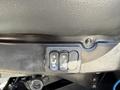 Close-up of seat adjustment controls with buttons for raising and lowering the seat and reclining the backrest on a 2009 International 7500
