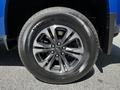 A close-up of the wheel of a 2021 Chevrolet Colorado featuring a shiny alloy rim and a Valera HT tire