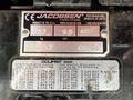A metal nameplate for a 2015 Jacobsen Eclipse 322 detailing model specifications weight power and serial numbers