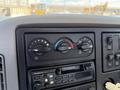Dashboard control panel of a 2008 International 7500 featuring climate control dials and a stereo system