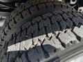 Close-up of a tread pattern on a tire of a 2008 Ford F-550 showing deep grooves and rugged design for off-road traction