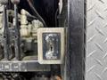 A control panel on a 2018 Kenworth T800 featuring a switch labeled with open and close indicators