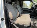 Interior view of a 2020 Ford F-350 SD showing front seats with gray fabric upholstery and seat belts