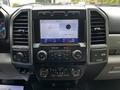 Dashboard of a 2020 Ford F-350 Super Duty featuring a central touchscreen display with various controls and buttons for audio and climate settings