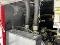 Close-up view of the engine compartment of a 2006 Emergency One Fire Truck showing hoses wires and mechanical components