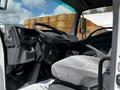 Interior view of a 2016 Isuzu NQR showing the driver's seat dashboard and steering wheel