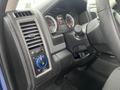 Interior view of a 2019 RAM 1500 Classic featuring a dashboard with gauges controls and a climate control knob