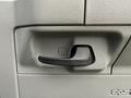 Close-up of the door handle of a 2022 Ford E-450 featuring a textured gray finish and a black lever