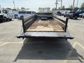A 2024 Southland SL716-20K trailer with an open flatbed showing dirt and a tire in the center