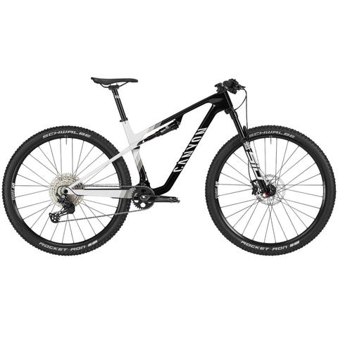 2025 Canyon Lux World Cup CF 7 Mountain Bike features a lightweight black and white frame with wide tires and advanced components designed for performance and agility on trails