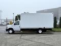 A white 2019 Ford Econoline box truck with a large cargo area and a flatbed, parked on a concrete surface