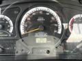 The dashboard of a 2012 Autocar Xpert showing speedometer and odometer readings with indicators for mileage and various vehicle functions