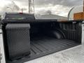 A 2016 Ford F-150 truck bed featuring a black diamond plate storage box on the left side