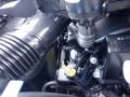 A 2016 Mercedes-Benz Sprinter engine compartment showing various mechanical components including hoses and the oil dipstick