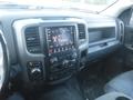 The interior dashboard of a 2019 RAM 1500 Classic Eco Diesel featuring a touchscreen display and various control knobs and buttons