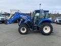 A blue 2016 New Holland T475 tractor features a front loader and large rear tires, showcasing its robust design for farming and agricultural tasks