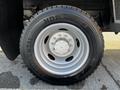 Close-up of a wheel from a 2011 Ford F-450 SD showcasing a silver rim and a black Continental HDR tire with visible tread patterns