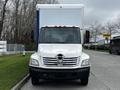 Front view of a white 2006 Hino 268 box truck with a large cargo area and prominent Hino logo on the grille