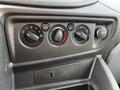 Dashboard controls of a 2018 Ford Transit featuring knobs for climate control and a USB port