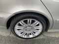 A close-up of a silver 2007 Mercedes-Benz E-Class wheel with a shiny alloy rim and Michelin tire