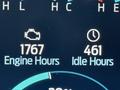 The dashboard display of a 2021 Ford F-150 showing engine hours and idle hours with a check engine icon