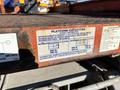 A close-up of a specifications label on a 2010 Skyjack SJ indicating platform capacities and weight limits for personnel and materials