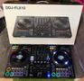 DDJ-FLX10 DJ controller featuring two decks with vinyl platters colorful performance pads and a central mixer section with various dials and sliders