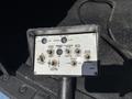 Control panel of a 2008 Ford E-350 featuring various buttons and switches for throttle speed engine start emergency power and boom control