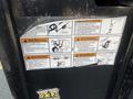 A close-up view of a warning label on a 2020 Load Trail 28 Foot Gooseneck trailer providing instructions and safety information
